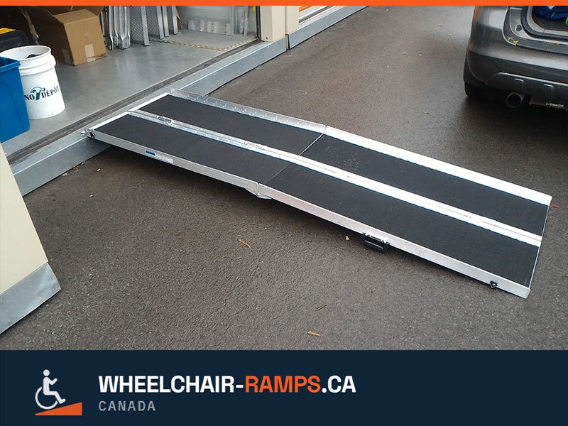 Portable folding wheelchair ramp